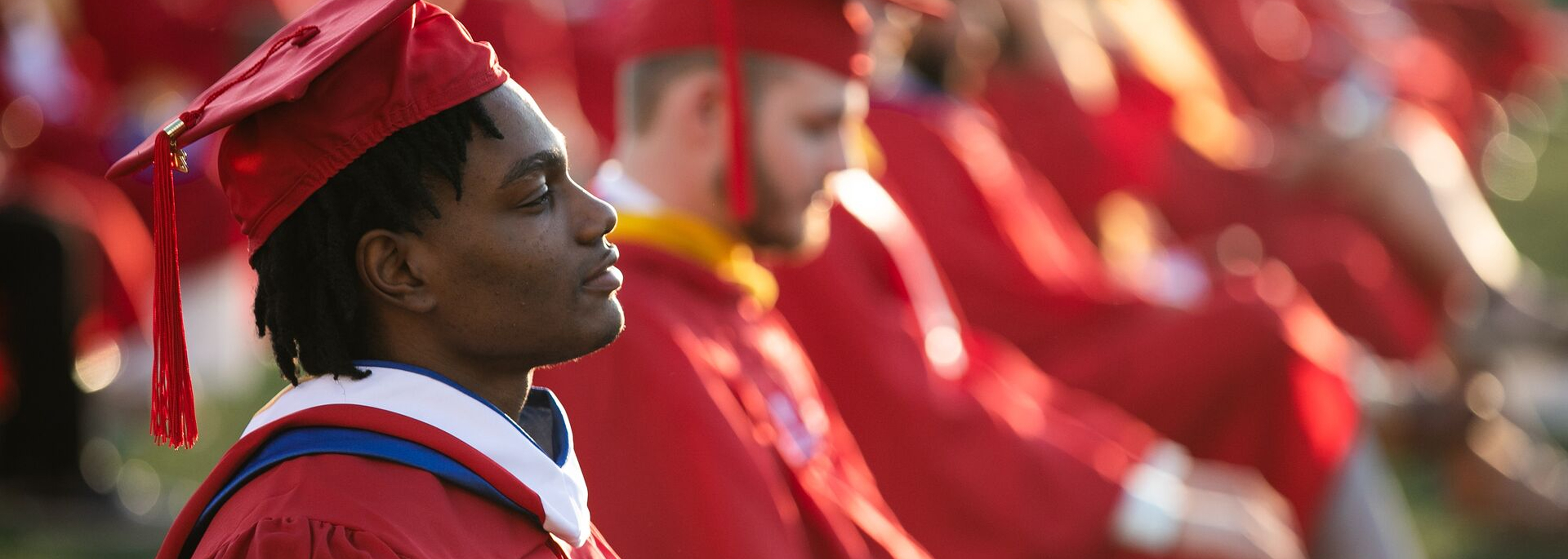 SUNY Stony Brook University College of Business Student at Graduation in their Grad Cap